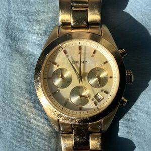 DKNY Gold finish watch. Mother of pearl dial face. Gently used.